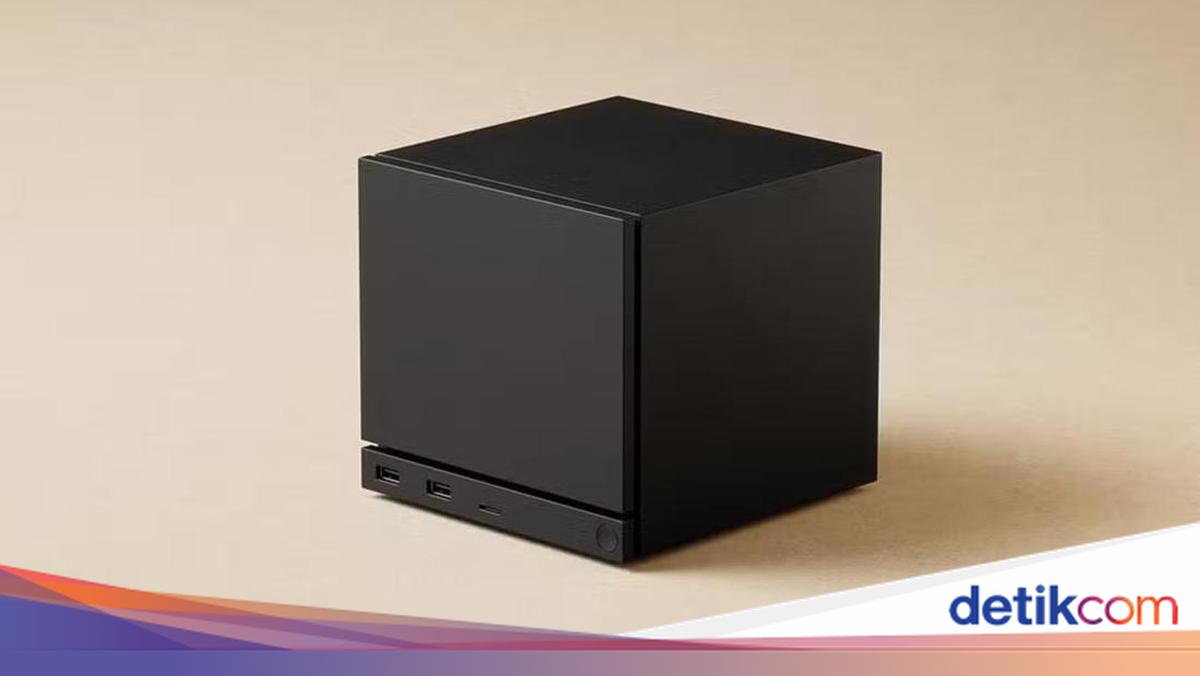 La console Steam Machine installée dans un salon à côté d'un écran de télévision